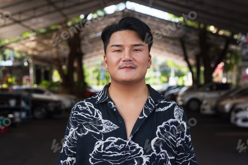 Preview: Portrait of Handsome Young Asian Man Outdoors in City