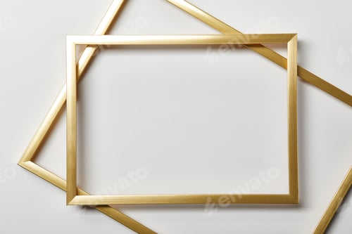 Preview: top view of empty golden frames on white background with copy space
