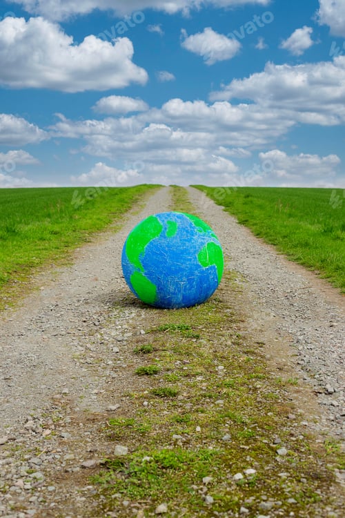 Preview: Planet Earth eco concept of nature protection. Surreal image. Planet on road.