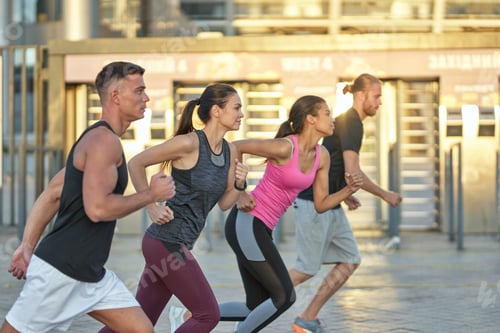 Preview: Young mixed race running team training outdoors