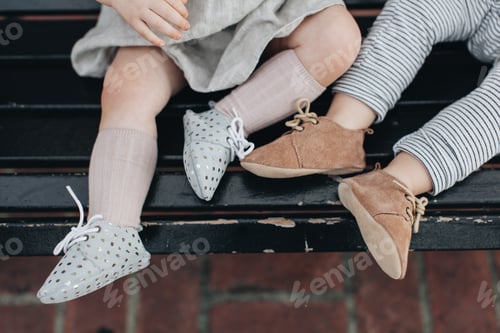 Preview: Two Toddlers Wearing Stylish Shoes on a Bench