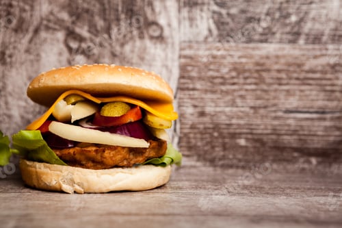 Preview: Home made burgers on wooden plate
