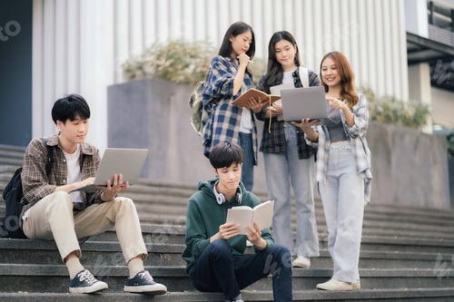 Preview: Asian college student reading a book study.