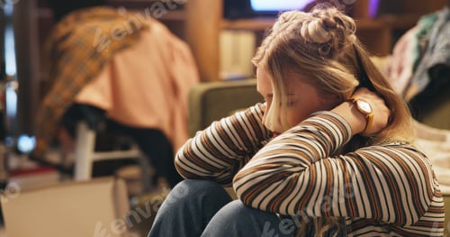 Preview: Woman, stress and moving on floor in home with boxes, neck pain and chaos with clothes in living ro
