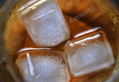 Preview: Close up top view iced whisky