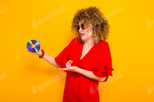 Preview: Attractive woman with curly hair with disc