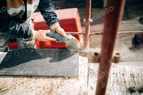 Preview: Construction site details - industrial tool, hand grinder of worker cutting marble