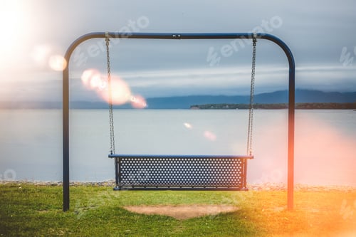 Preview: Swings at lake shore