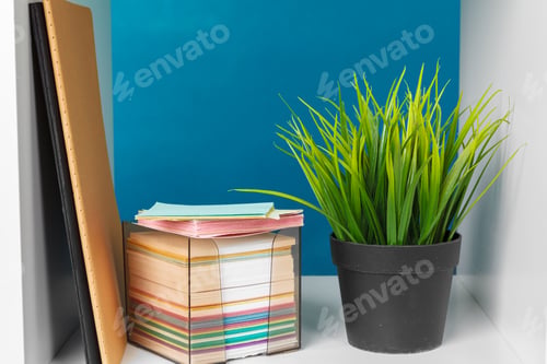 Preview: White office shelves with different stationery, close up