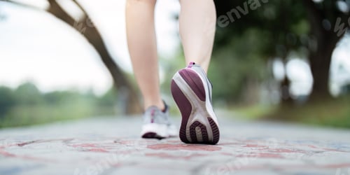 Preview: Close up of woman running shoes on a picturesque path, emphasizing fitness and active lifestyle