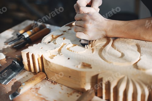 Preview: The carpenter works with a tree