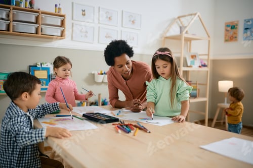 Preview: Black female teacher having art class with group of kids at preschool.
