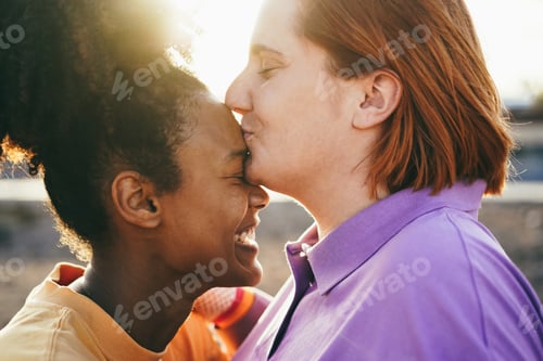 Preview: Happy women gay couple having tender moments outdoor - Lgbt and love concept