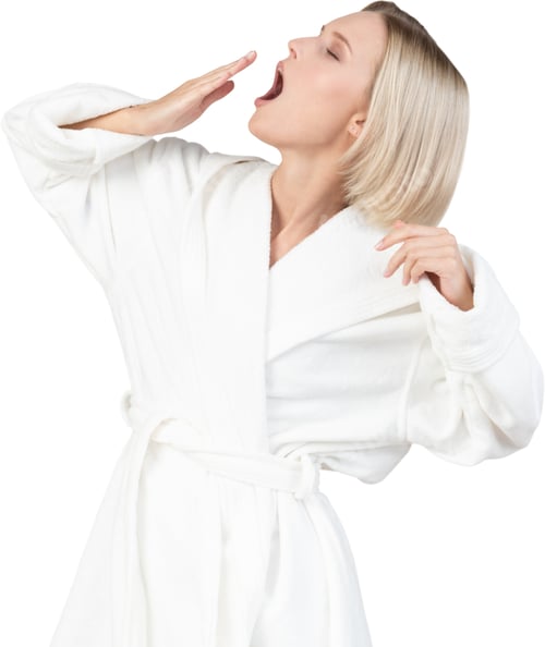 Preview: a woman in a white robe eating a candy bar