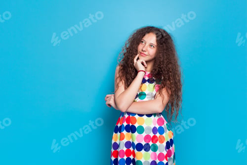 Preview: Curly woman in colorful dress