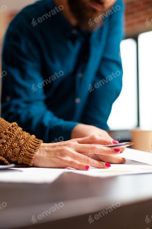 Preview: Closeup of businesspeople hands analysing marketing paperworks working at company presentation