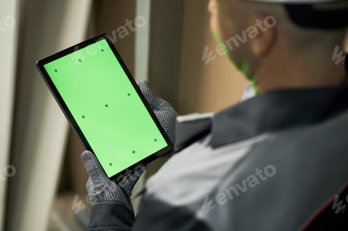 Preview: Unrecognizable Man Holding Tablet