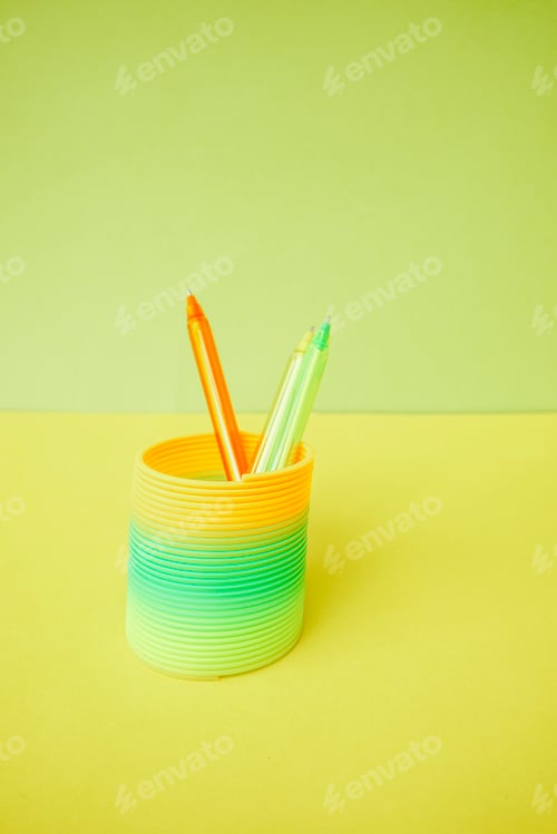 Preview: Colorful pens inside a colorful slinky toy