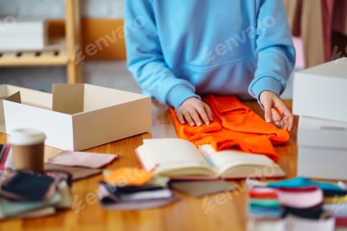 Preview: Close-up of preparing a parcel on the table. Woman online store, small business owner, entrepreneur.