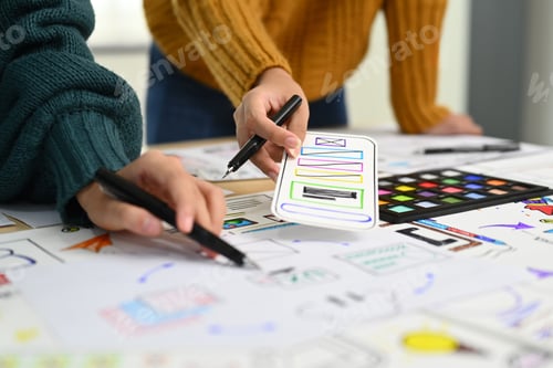 Preview: Team of creative designer working on app design and user interface, developing mobile application.