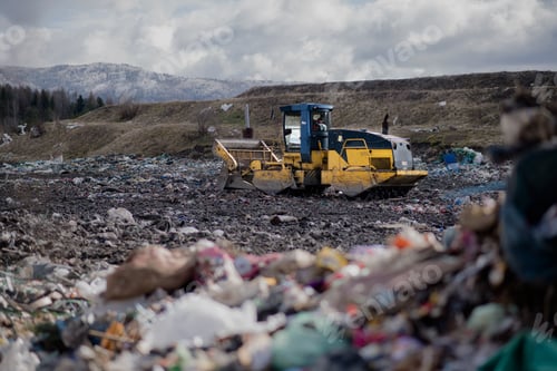 Preview: Garbage truck unloading waste on landfill, environmental concept