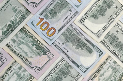 Vista previa: Many one hundred and fifty dollar bills on flat background surface close up