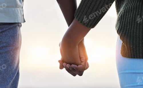 Preview: Couple, holding hands and together outdoor at the beach with love, care and commitment. Closeup of
