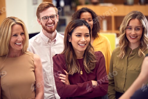 Preview: Portrait Of Smiling Multi-Cultural Business Team Standing In Modern Open Plan Office