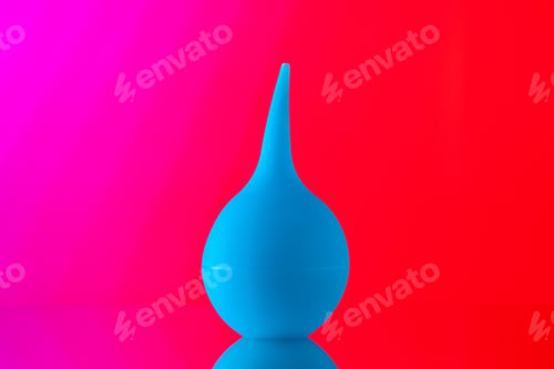 Preview: front view bulb syringe aspirator on light red background