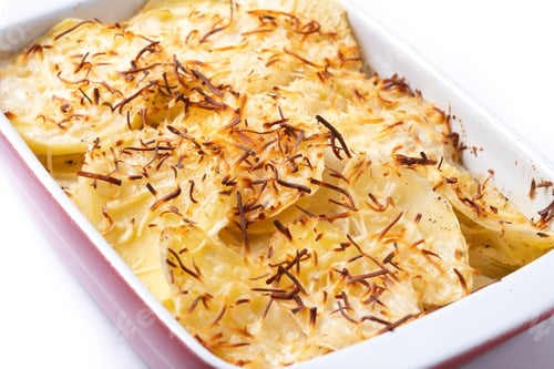 Preview: Potato gratin baked with cream and cheese isolated on white background