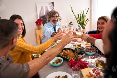 Preview: Three generations of smiling Caucasians celebrating domestic life toast with glasses white wine.