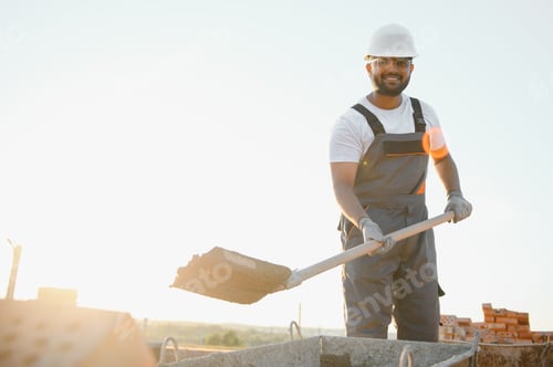Preview: Indian Construction worker in uniform and safety equipment have job on building