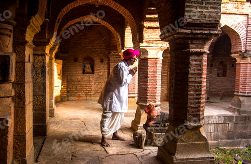 Preview: An Indian man prays at a Temple, India