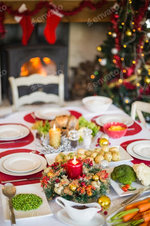 Preview: Christmas dinner table with food at home in the living room