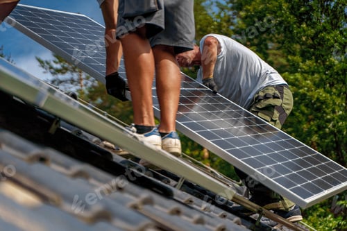 Preview: Men worker installing solar photovoltaic panels on roof, alternative energy, saving resources and