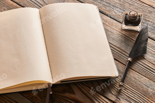 Preview: Feather pen and blank notebook page