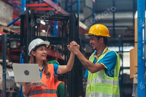 Preview: Warehouse management team using computer laptop check stock inventory. Asian men women worker