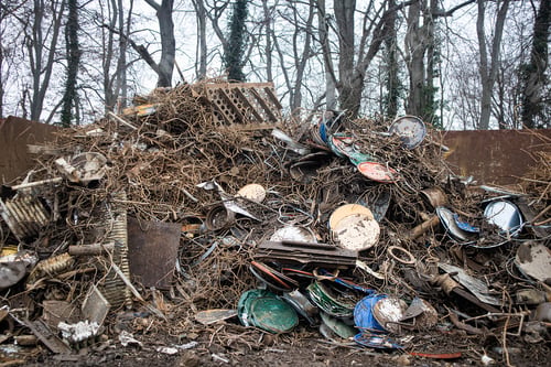 Preview: A pile of old scrap metal for recycling and disposal is wire, iron rods .