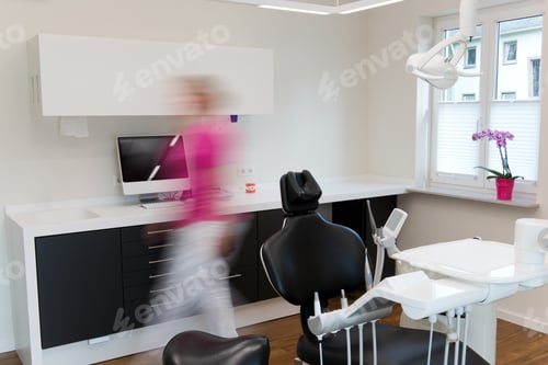 Preview: Blurred Motion Of Woman Walking In Speed At Dentist'S Office