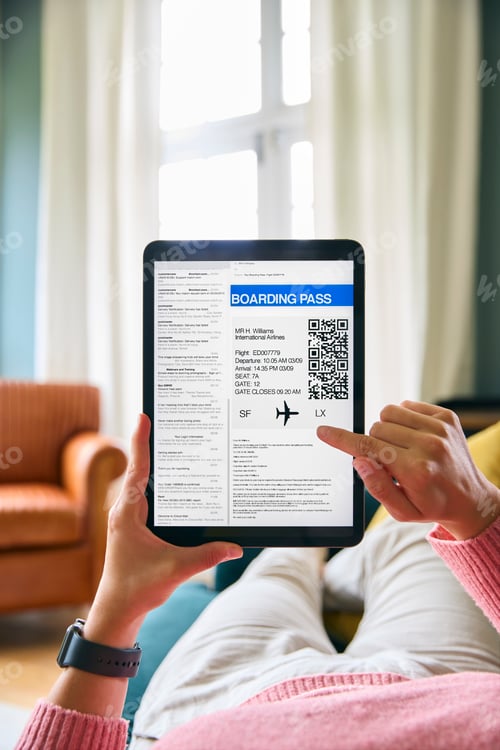 Preview: Close Up Of Woman Downloading Electronic Boarding Pass For Flight On Digital Tablet At Home
