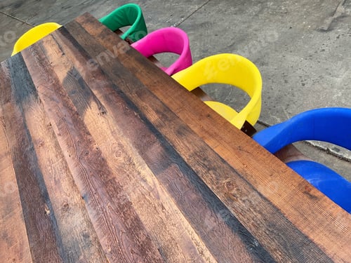 Preview: Rustic table and bright colors chairs