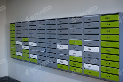 Preview: Multi-colored mailboxes in indoor lobby. Perspective, selective focus