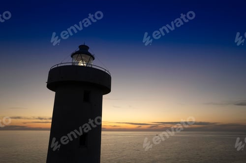 Preview: Aerial view of a maritime lighthouse taken at night