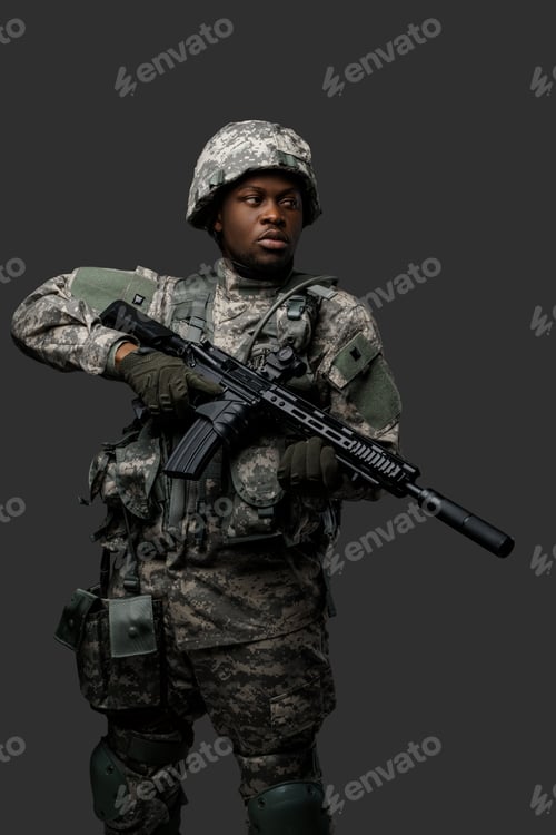 Preview: Courageous black soldier dressed in uniform and holding rifle