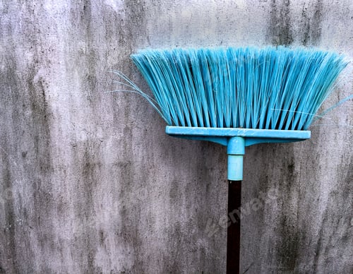 Preview: Old Cyan Plastic Broomstick for Cleaning Wet Floor Against Dirty Wall