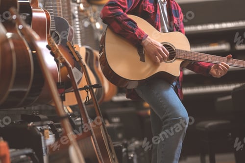 Preview: Young man playing the guitar