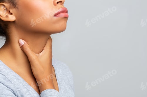 Preview: Black woman touching her neck, having pain in throat