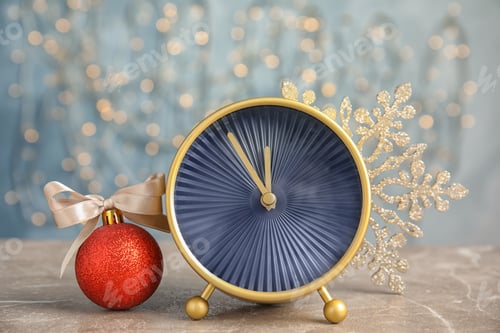 Preview: Alarm clock and decorations on table. Christmas countdown