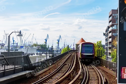 Preview: Hamburg Red U-bahn Subway train departure Baumwall station on Elevated Track with Hamburger Port