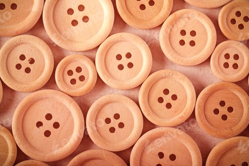 Preview: Wooden Buttons Lie On A White Background